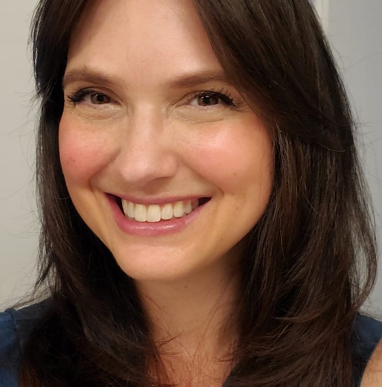 A person smiling at the cameraAI-generated content may be incorrect.